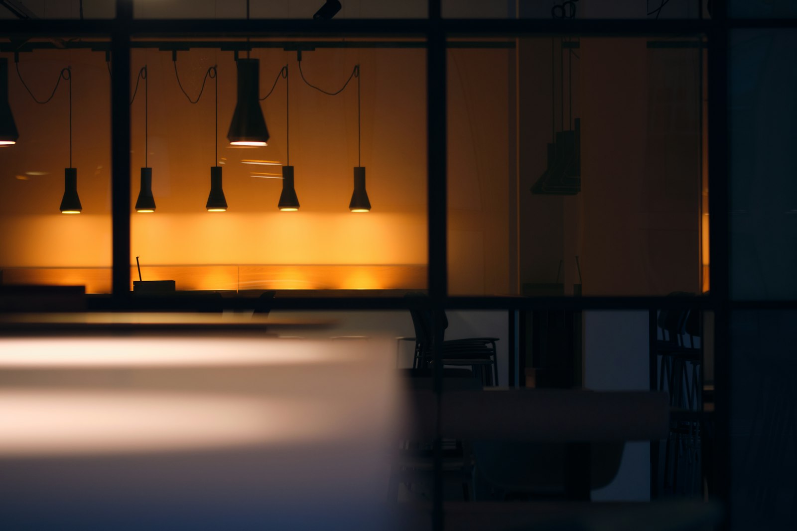 A commercial office interior lit at night.