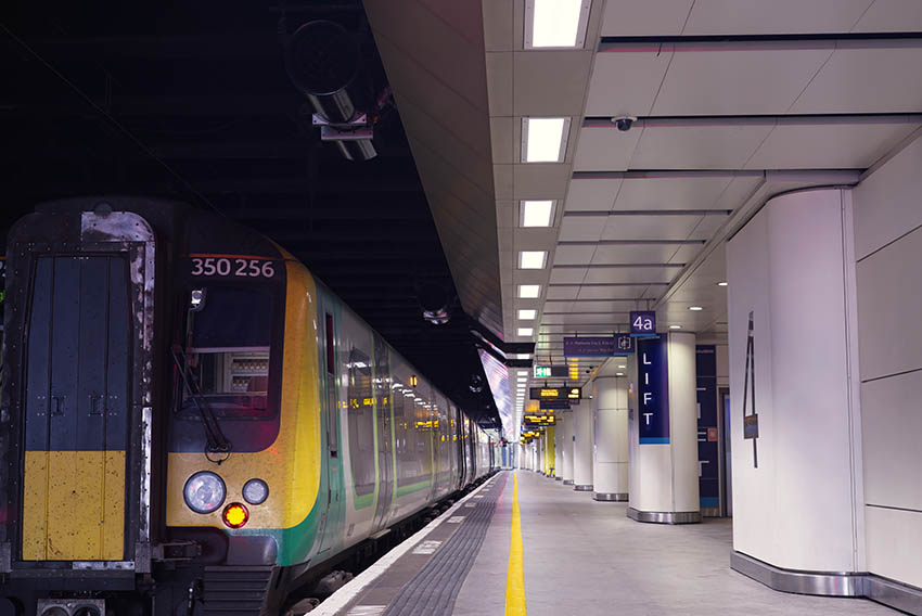 Lighting scheme installed across a large UK transport concourse.